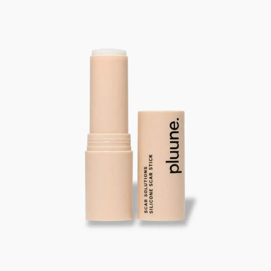 Pluune silicone scar stick in nude tube, open with cap beside, white background